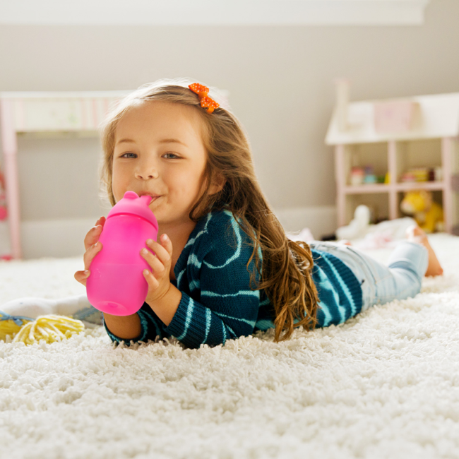 Girl sipping on Munchkin Simple Clean Cup